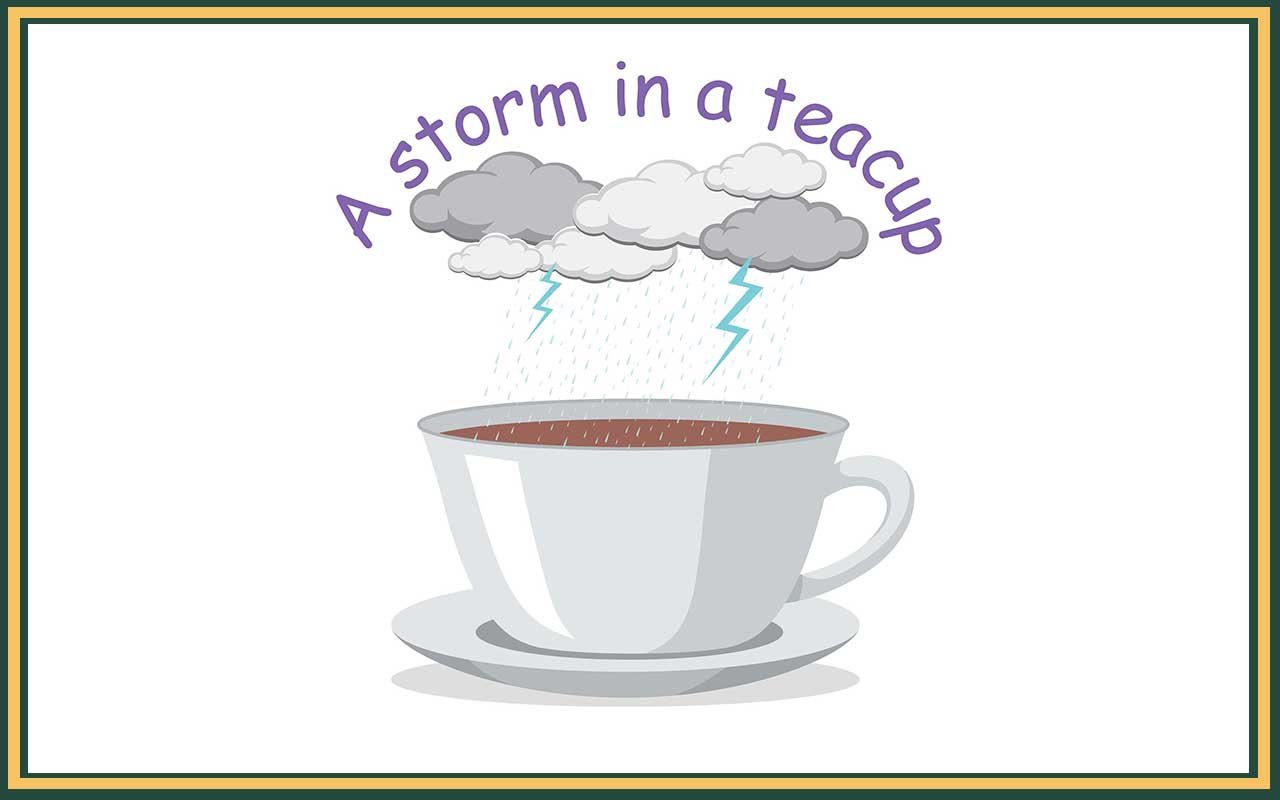 a cup of tea with a stormy cloud above to represent the idiom storm in a tea cup