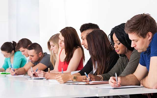 craft and structure sat questions answered by a row of students studying for the digital sat test